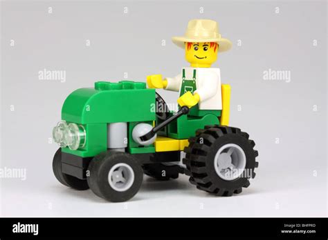 Lego farmer driving tractor Stock Photo - Alamy