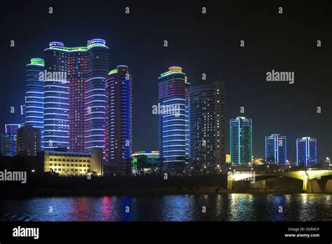 Modern city apartments illuminated at night, Pyongyang, Democratic ...