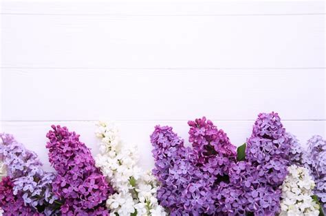Premium Photo | Lilac flowers branch on white wooden with copyspace
