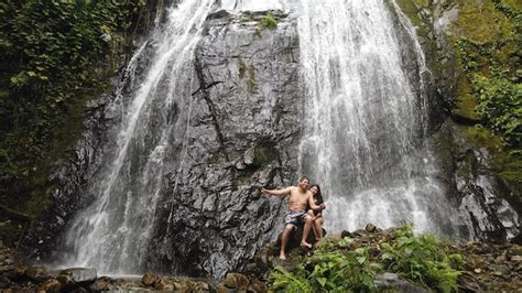 Premium Photo | Tourists visiting waterfalls in the jungle of peru ...