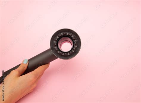 Dyson Supersonic hair dryer attachments in use haircare fuchsia/nickel Stock Photo | Adobe Stock