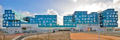 This Danish school is completely covered with over 12,000 sea green solar panels