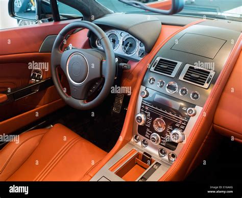 interior cockpit/dashboard of an expensive sports car lined in leather and carbon fiber Stock ...