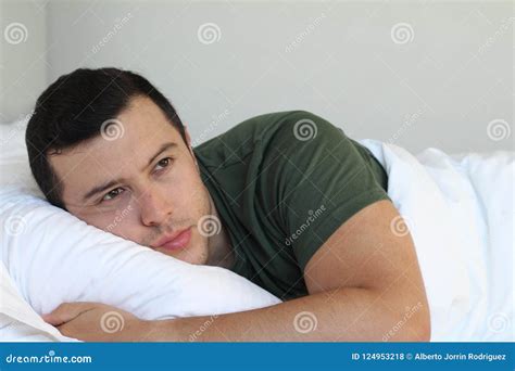 Heartbroken Young Man Laying Down in Bed Stock Photo - Image of ...