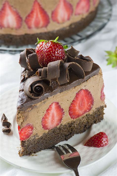 a piece of chocolate cake with strawberries on top