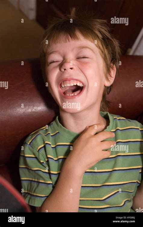 five year old boy laughing hard with mouth open Stock Photo, Royalty Free Image: 17100233 - Alamy