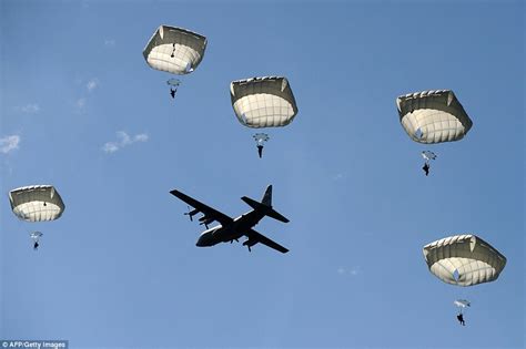 Skies above Normandy filled with 1,000 paratroopers as huge crowd ...