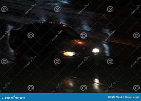 Speeding Car in the Night stock image. Image of road - 258675763