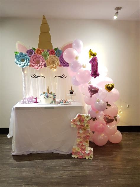 Unicorn set-up for a sweet first birthday party | First birthday party decorations, Birthday ...