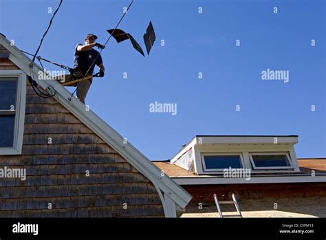 Roof shingles worker hi-res stock photography and images - Alamy