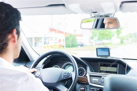 Young Taxi driver driving his car — Stock Photo © Kzenon #83108818