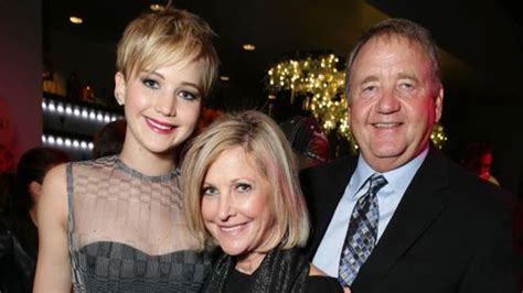 Jennifer Lawrence with her parents at the Catching Fire LA Premiere ...