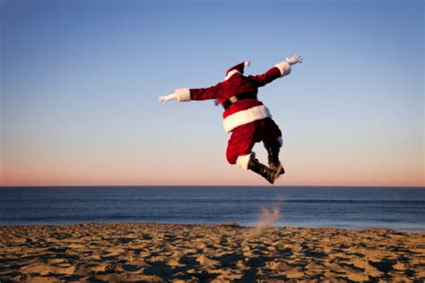 Santa Claus Happy On Vacation At The Beach Stock Photo - Download Image Now - iStock