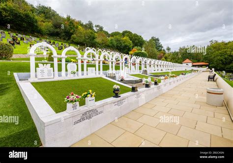 Memorial arches and graves, Bryntaf Cemetery, Aberfan Cemetery, Glamorgan, Wales, resting place ...