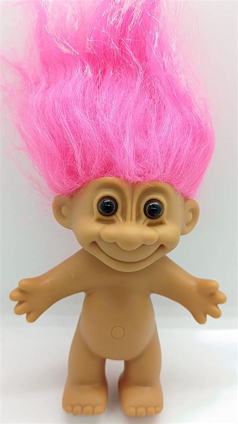 67. Doll with fluffy hair: TROLL . Lots of trolls at our local flea market. I just don't see the ...