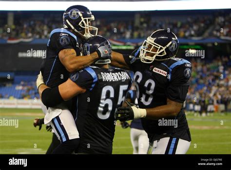 Toronto Argonauts wide receiver guard Chad Owens (2) celebrates his touchdown with teammates ...