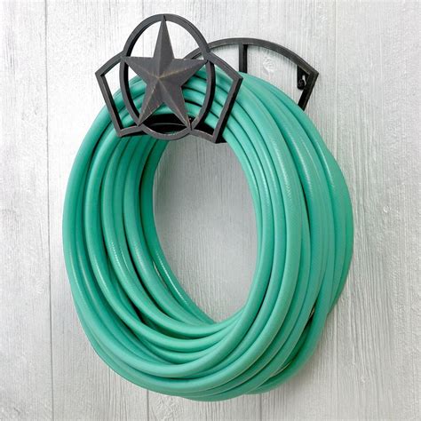 Hampton Bay Star Hose Hanger-234 - The Home Depot | Hose hanger, Garden hose, Garden hose hanger