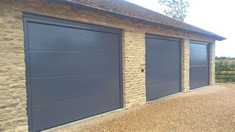 Trio of iso 45 Flush Sectional Garage Doors in RAL7015 - Elite GD