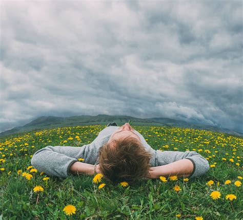 "Man Resting On The Grass" by Stocksy Contributor "Ibex.media" - Stocksy