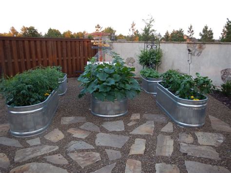 We used stock tanks for our raised beds. They are working great ...