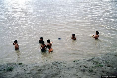 Children swimming in the Amazon River - Geographic Media