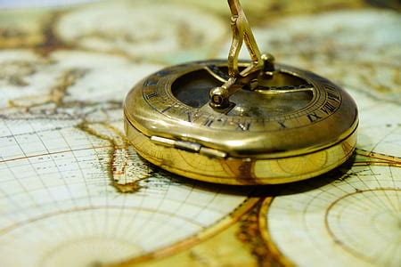 Royalty-Free photo: Macro photography of brown navigational compass | PickPik