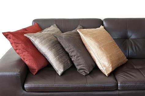 Brown Leather Sofa With Grey Pillows | Baci Living Room