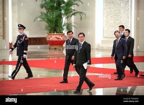 Laos' Prime Minister Thongloun Sisoulith, center, arrives for a meeting with Chinese President ...