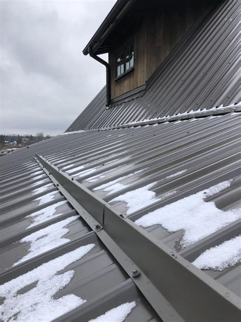 how do metal roof snow guards work - Violette Cupp