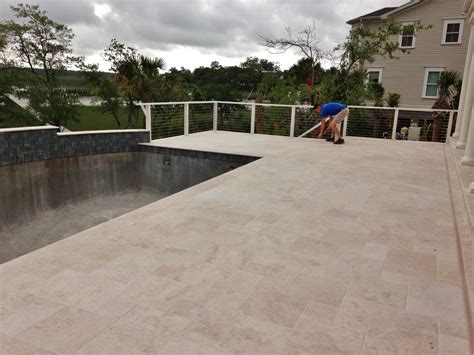 Travertine pool deck set in the French or Versaille pattern | Travertine pool decking ...