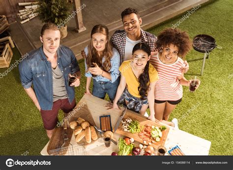 Young friends at picnic — Stock Photo © AlexFedorenko #154088114