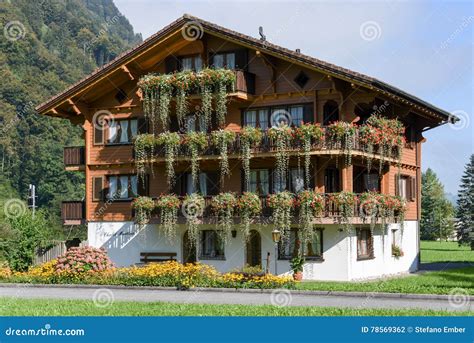 Beautiful Chalet Adorned with Flowers at Wolfenschiessen, Switzerland Editorial Photography ...