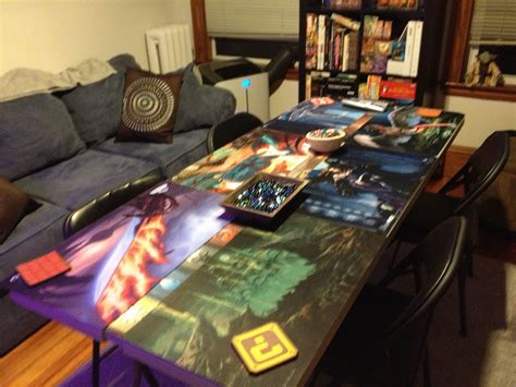 Table in game room set up for MTG with playmats, dice, coasters, etc. | Game room, Room set, Room