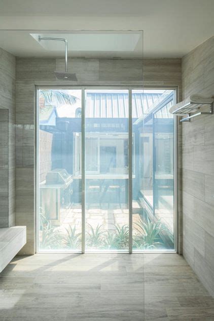 Modern Bathroom by Bayview Design Group Australia - privacy glass becomes opaque with just a ...
