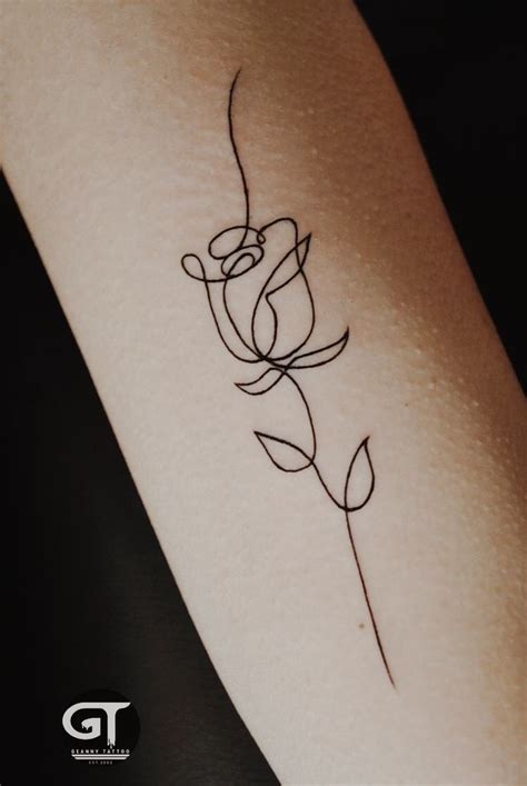 Delicate Rose Tattoo on Woman's Arm