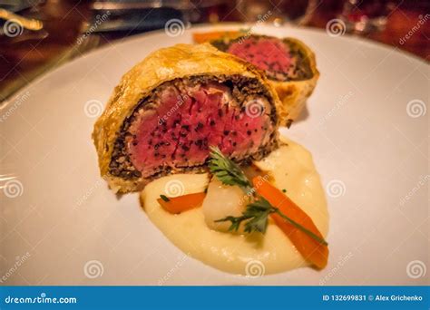 Slice of Beef Wellington with Spinach and Carrots Stock Image - Image of pancake, filet: 132699831