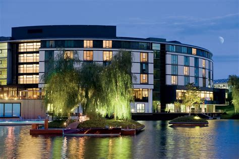 The Ritz-Carlton, Wolfsburg curves away from the lake into the evening ...