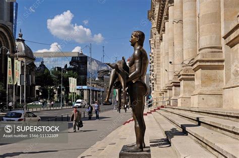 statue of the Roman emperor Trajan, by the sculptor Vasile Gorduz, in front of the National ...