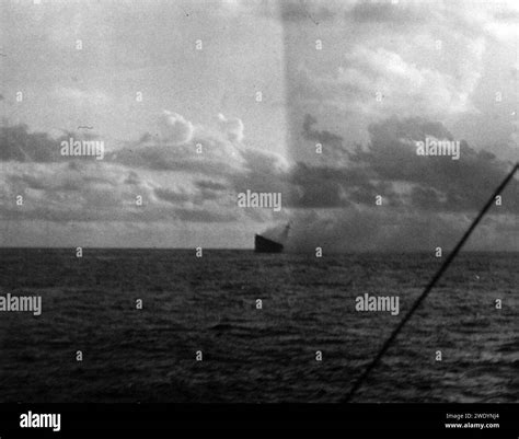 Aft view of the burning and listing USS Hornet (CV-8) during the Battle of Santa Cruz Islands ...