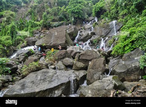 Tourists enjoying the hilly 'Mayabi Jhorna' waterfalls located at the ...