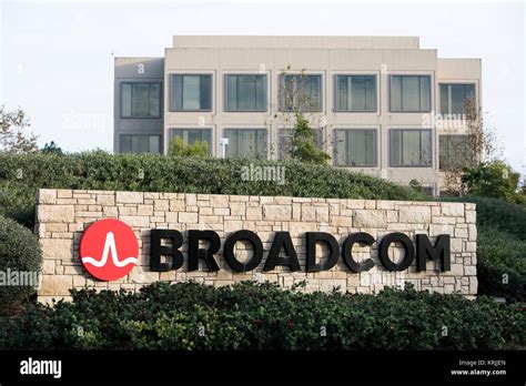 A logo sign outside of the headquarters of the Broadcom Corporation in ...