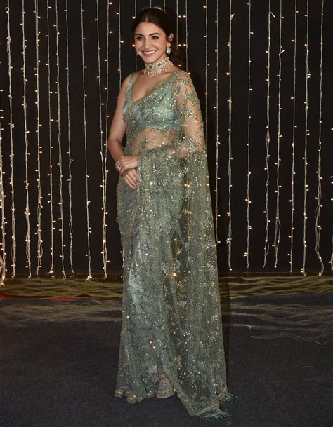 Going for a friend's wedding reception? Wear Anushka Sharma's green Sabyasachi sari | VOGUE India