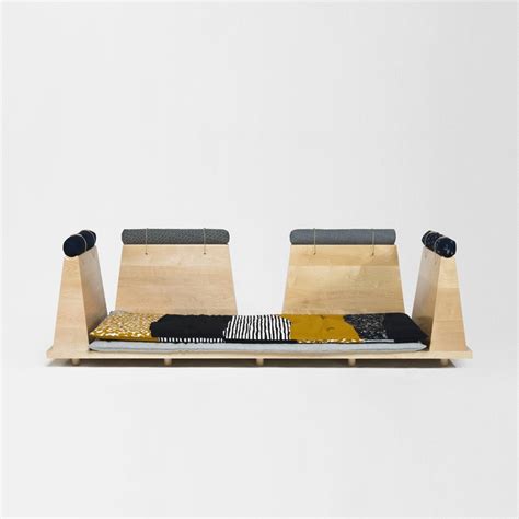 Umé Studio has created a modular sofa with bolsters, wooden units and traditional Japanese ...