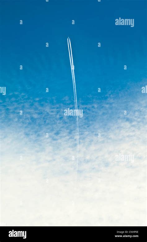 An airplane with a vapor trail Stock Photo - Alamy