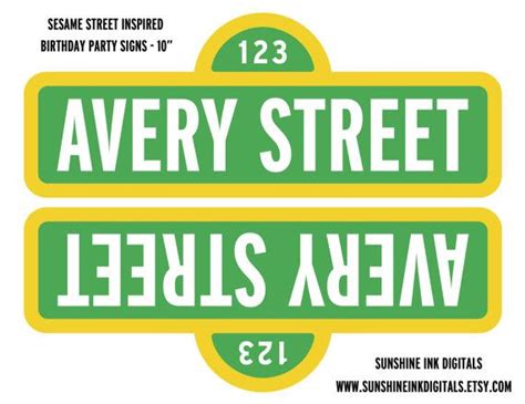 two green and yellow street signs with the words avery street in hebrew font on them