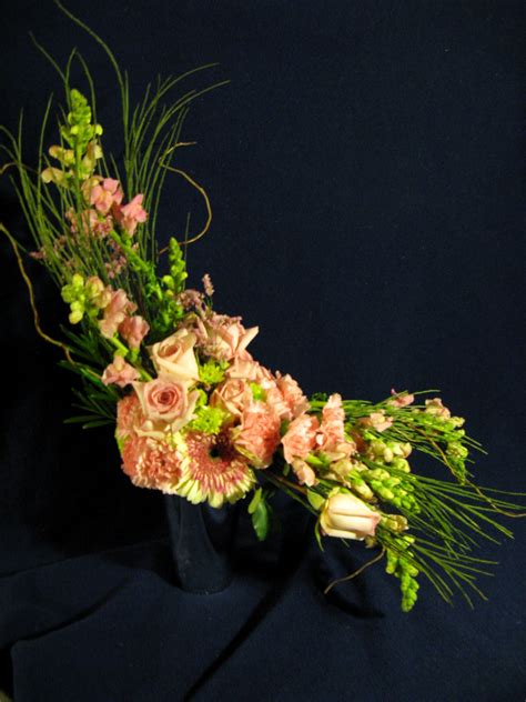 asymmetrical flower arrangement | Flower arrangements, Planting flowers, Flowers