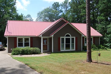 Red Brick House With Brown Metal Roof