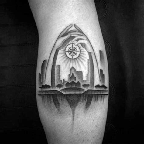 a man's leg with a black and white tattoo on it, depicting the city skyline