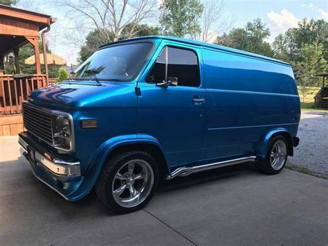 Vintage Blue Van Parked in Front of House