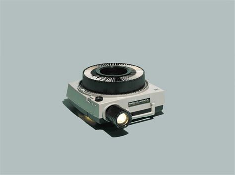 an old fashioned camera on a gray background with light coming from it's lens